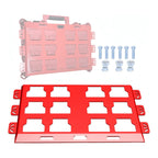 Red and pink plastic trays with small components on a white background